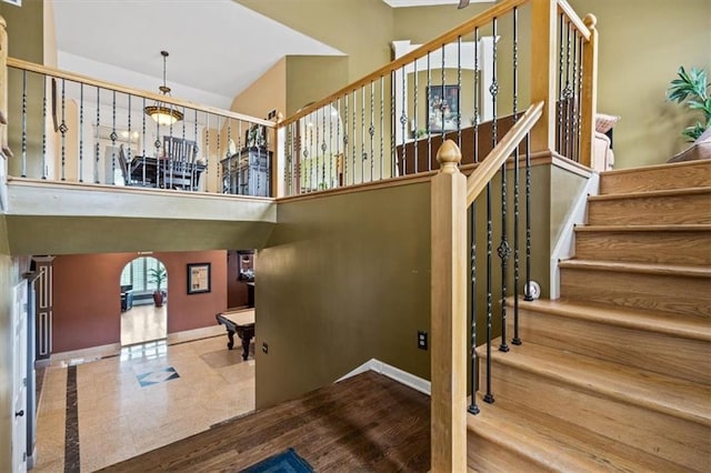 12848 S Rene St, Olathe, KS 66062 - stairs with baseboards and a high ceiling