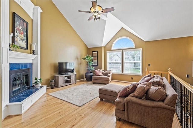 12848 S Rene St, Olathe, KS 66062 - living area with a ceiling fan, high vaulted ceiling, wood finished floors, and a fireplace