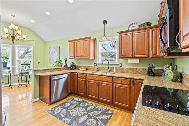 12848 S Rene St, Olathe, KS 66062 - kitchen featuring a peninsula, lofted ceiling, black electric cooktop, a sink, and dishwasher