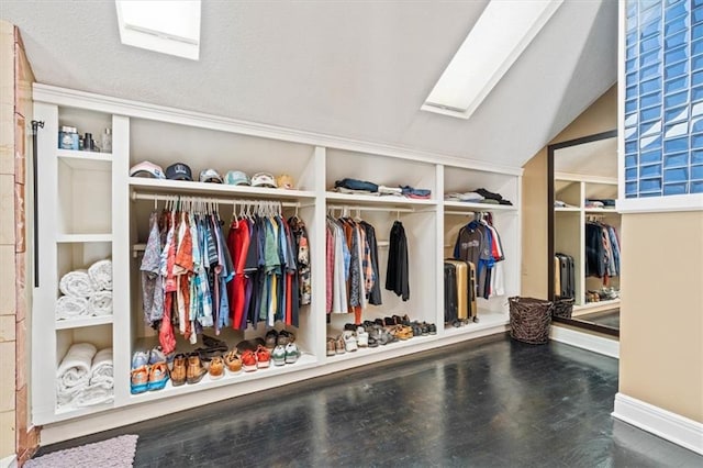 12848 S Rene St, Olathe, KS 66062 - walk in closet featuring wood finished floors and vaulted ceiling with skylight