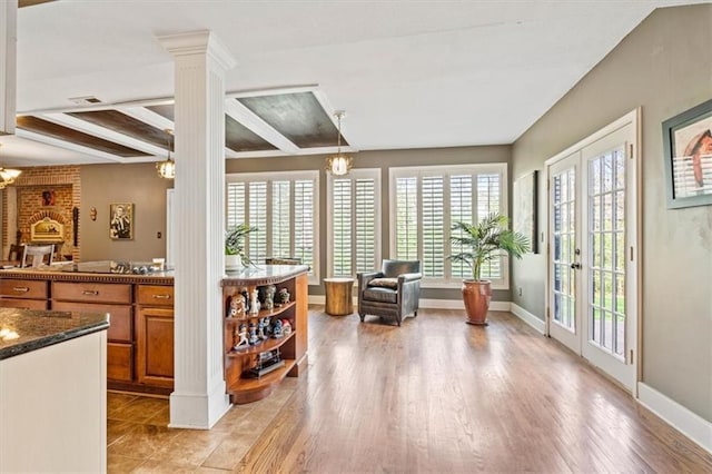 12848 S Rene St, Olathe, KS 66062 - interior space featuring beam ceiling, baseboards, ornate columns, french doors, and light wood finished floors
