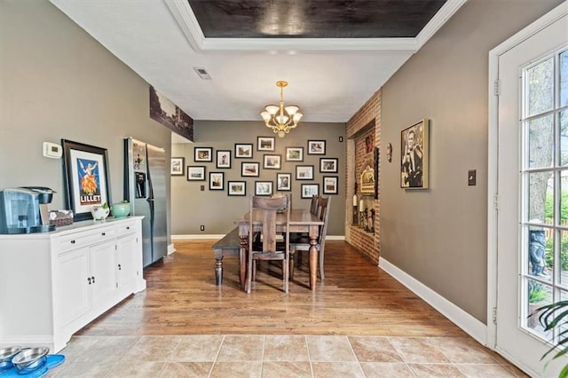 12848 S Rene St, Olathe, KS 66062 - dining room with baseboards, an inviting chandelier, ornamental molding, and visible vents