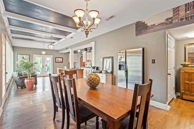 12848 S Rene St, Olathe, KS 66062 - dining area featuring visible vents, a chandelier, french doors, and light wood-type flooring