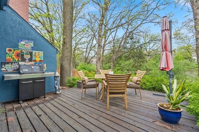 12848 S Rene St, Olathe, KS 66062 - wooden terrace with outdoor dining area