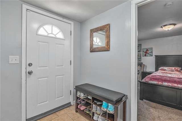 foyer entrance featuring light tile patterned floors