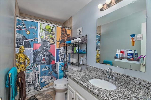 full bath with toilet, vanity, and tile patterned floors