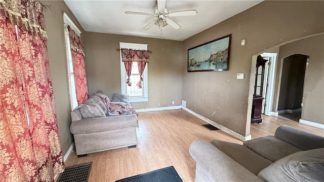 2901 Farrow Ave, Kansas City, KS 66104 - living area with visible vents, baseboards, light wood-type flooring, and a ceiling fan
