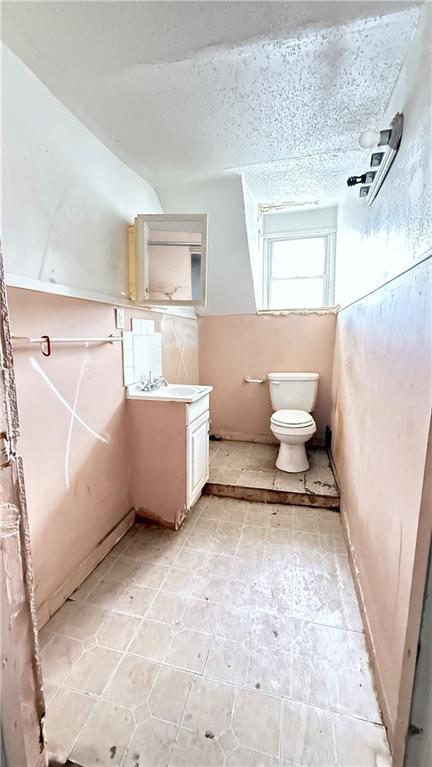 2901 Farrow Ave, Kansas City, KS 66104 - bathroom featuring tile patterned floors, toilet, and vanity
