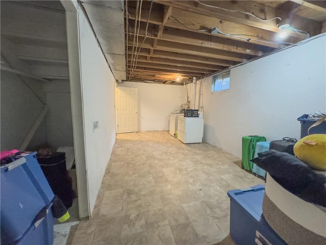 below grade area featuring washer and clothes dryer