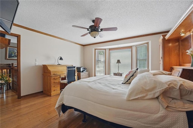 bedroom with crown molding, baseboards, and light wood-type flooring