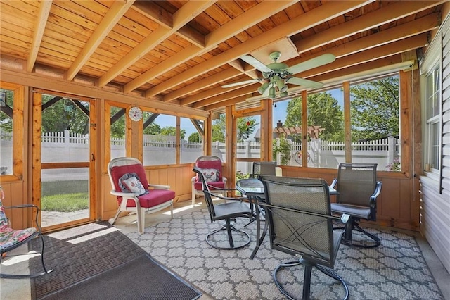 sunroom / solarium featuring outdoor dining area, ceiling fan, and a healthy amount of sunlight