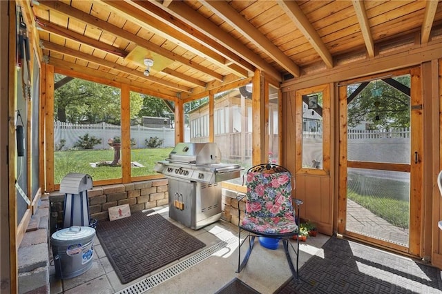 sunroom with beamed ceiling