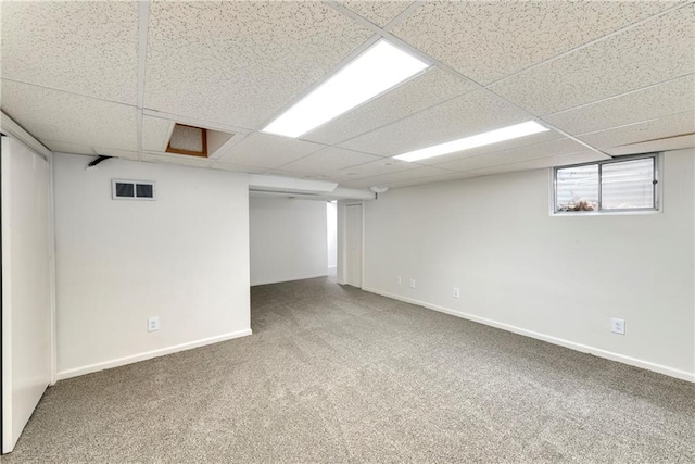9738 Nieman Pl, Overland Park, KS 66214 - basement with visible vents, a paneled ceiling, carpet floors, and baseboards