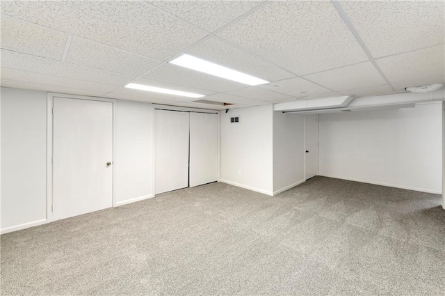 9738 Nieman Pl, Overland Park, KS 66214 - finished below grade area with carpet flooring, baseboards, and a paneled ceiling