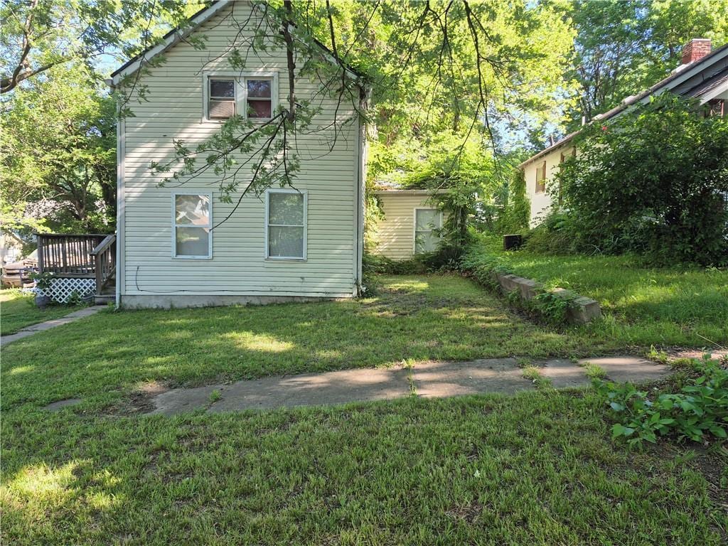 716 Olive St, Leavenworth, KS 66048 - rear view of property featuring a yard and a deck