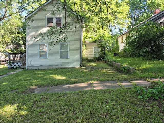 716 Olive St, Leavenworth, KS 66048 - rear view of property featuring a yard and a deck