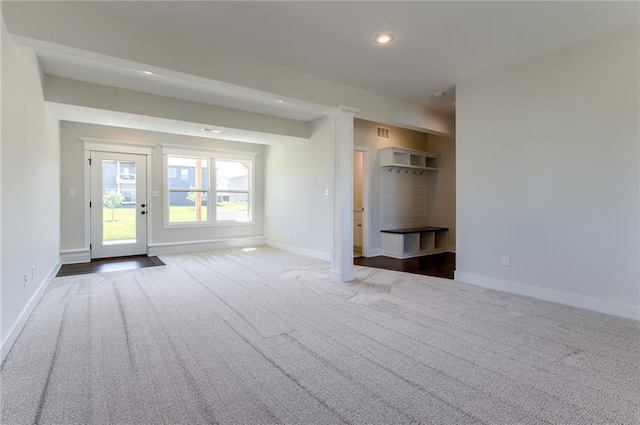 1308 N Holland Dr, Independence, MO 64056 - unfurnished living room with carpet floors, baseboards, and recessed lighting