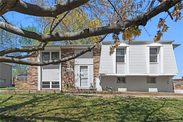 5101 NW Downing St, Blue Springs, MO 64015 - view of front facade featuring a front yard and brick siding
