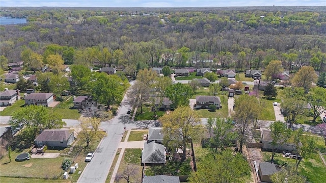 5101 NW Downing St, Blue Springs, MO 64015 - aerial overview of property's location featuring a forest and nearby suburban area