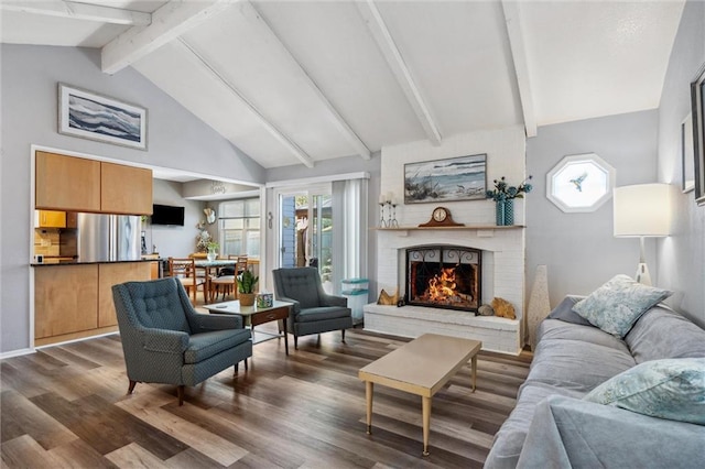 5101 NW Downing St, Blue Springs, MO 64015 - living area featuring beam ceiling, wood finished floors, a fireplace, and high vaulted ceiling