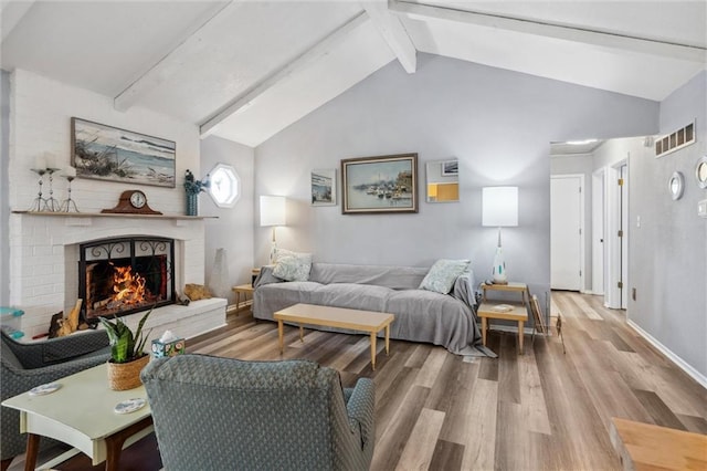 5101 NW Downing St, Blue Springs, MO 64015 - living area featuring wood finished floors, a fireplace, and baseboards