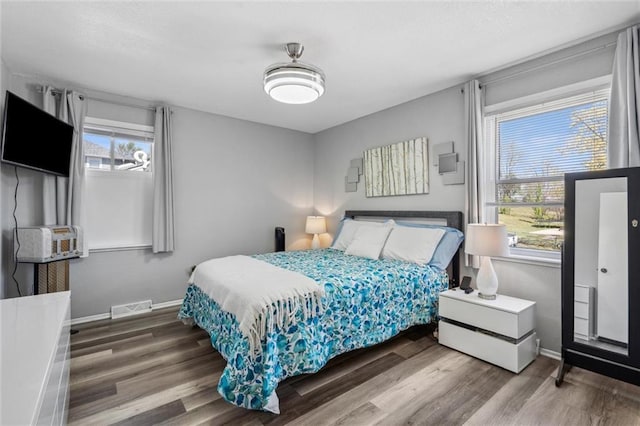 5101 NW Downing St, Blue Springs, MO 64015 - bedroom featuring wood finished floors and baseboards