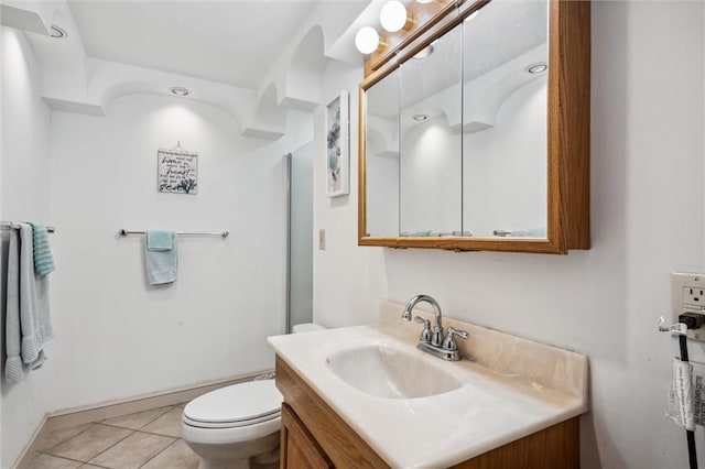 5101 NW Downing St, Blue Springs, MO 64015 - bathroom with vanity, toilet, tile patterned floors, and baseboards