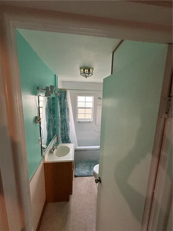 full bath featuring toilet, shower / tub combo, and vanity