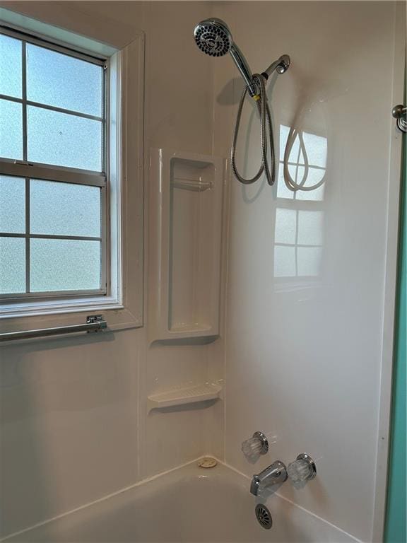 details featuring shower / bathing tub combination