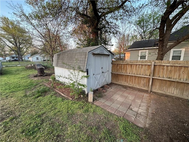 view of shed featuring fence