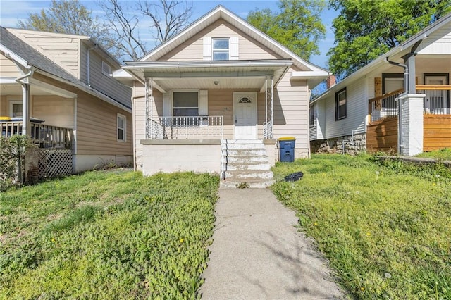 442 N Colorado Ave, Kansas City, MO 64123 - bungalow-style home featuring covered porch