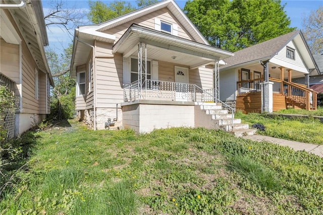442 N Colorado Ave, Kansas City, MO 64123 - bungalow featuring stairway and covered porch