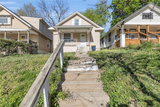 442 N Colorado Ave, Kansas City, MO 64123 - view of front facade with stairs and covered porch