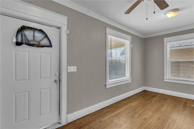 442 N Colorado Ave, Kansas City, MO 64123 - foyer with wood-type flooring, baseboards, crown molding, and ceiling fan