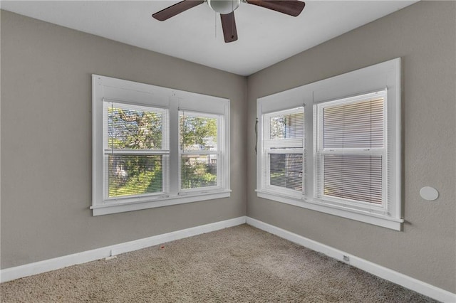 442 N Colorado Ave, Kansas City, MO 64123 - carpeted empty room with a ceiling fan and baseboards