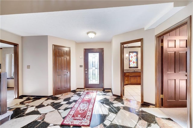 1707 NW Ashton Dr, Blue Springs, MO 64015 - entryway featuring light tile patterned floors and baseboards