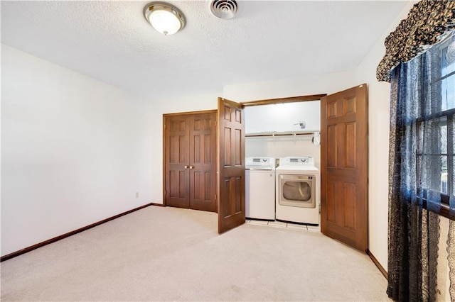 1707 NW Ashton Dr, Blue Springs, MO 64015 - laundry area featuring laundry area, light colored carpet, visible vents, baseboards, and washing machine and dryer