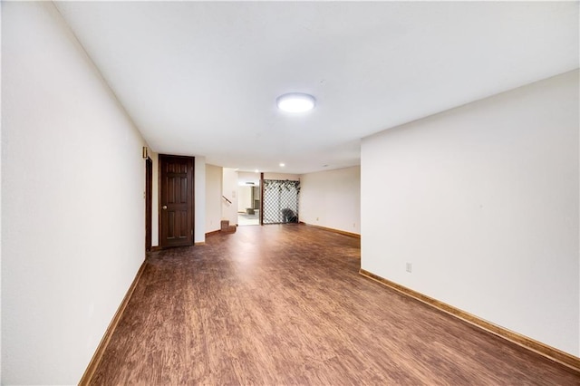 1707 NW Ashton Dr, Blue Springs, MO 64015 - unfurnished living room with baseboards, wood finished floors, and stairs