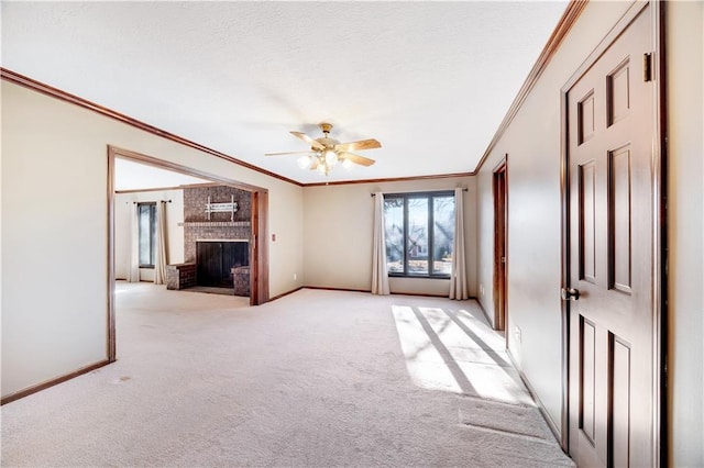 1707 NW Ashton Dr, Blue Springs, MO 64015 - unfurnished living room featuring light carpet, a fireplace, crown molding, and ceiling fan