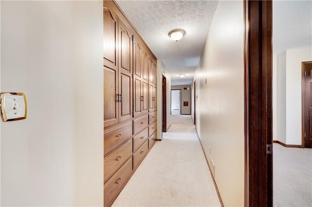 1707 NW Ashton Dr, Blue Springs, MO 64015 - hall featuring a textured ceiling, baseboards, and light carpet