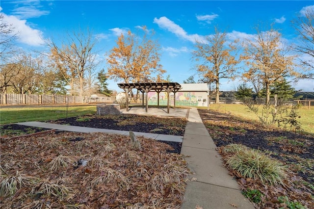1707 NW Ashton Dr, Blue Springs, MO 64015 - view of community featuring fence, a lawn, and a pergola