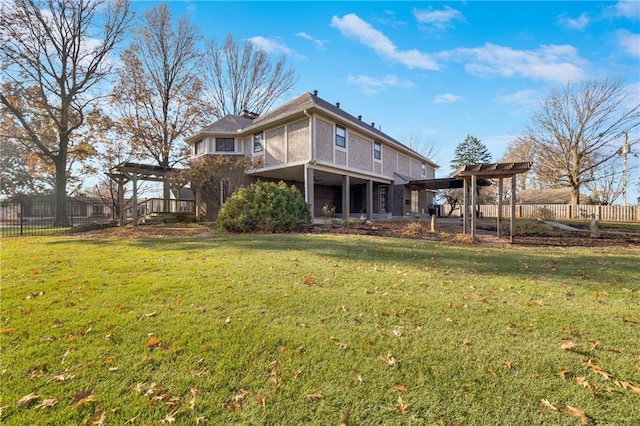 1707 NW Ashton Dr, Blue Springs, MO 64015 - rear view of house featuring a yard and fence