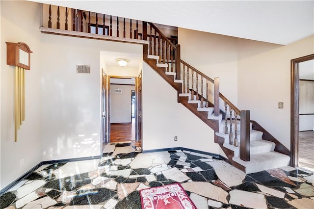 1707 NW Ashton Dr, Blue Springs, MO 64015 - entrance foyer featuring stairway, visible vents, and baseboards