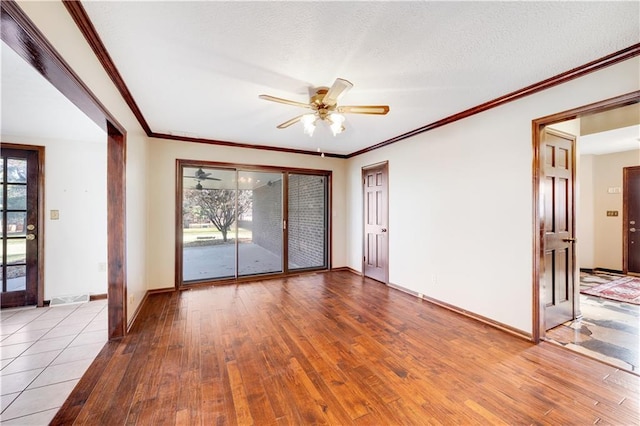 1707 NW Ashton Dr, Blue Springs, MO 64015 - empty room with baseboards, ornamental molding, ceiling fan, a textured ceiling, and hardwood / wood-style floors