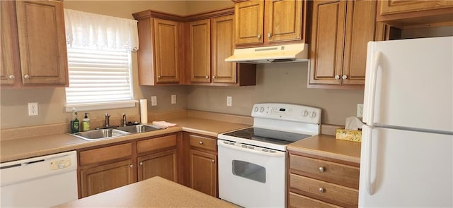 1219 S 3rd St, Louisburg, KS 66053 - kitchen with white appliances, under cabinet range hood, brown cabinets, and light countertops
