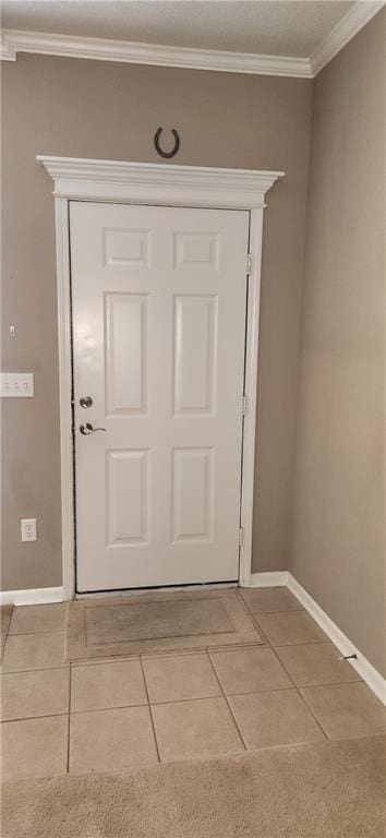 1219 S 3rd St, Louisburg, KS 66053 - entryway with light tile patterned floors and ornamental molding