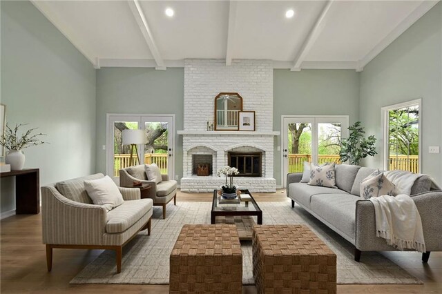 living room featuring recessed lighting, beam ceiling, and wood finished floors