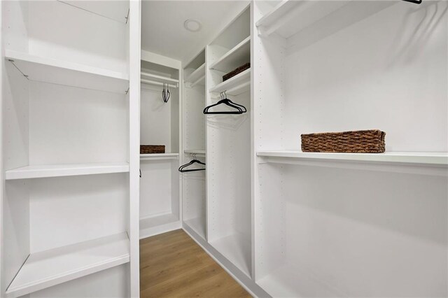 spacious closet with wood finished floors