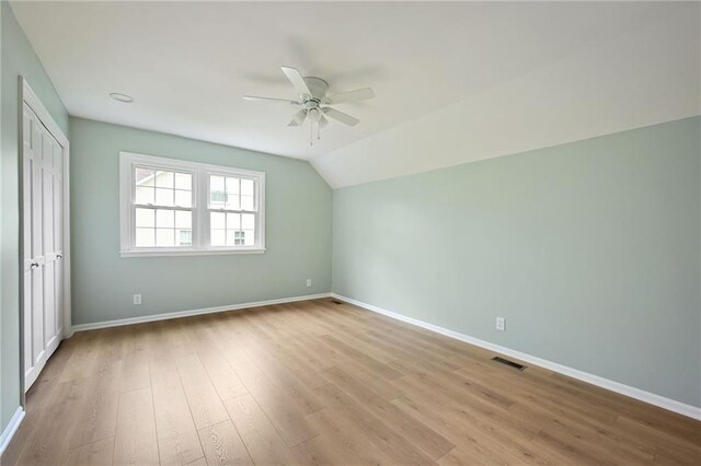 unfurnished bedroom featuring visible vents, baseboards, and wood finished floors