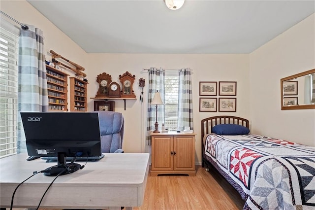 bedroom with light wood finished floors